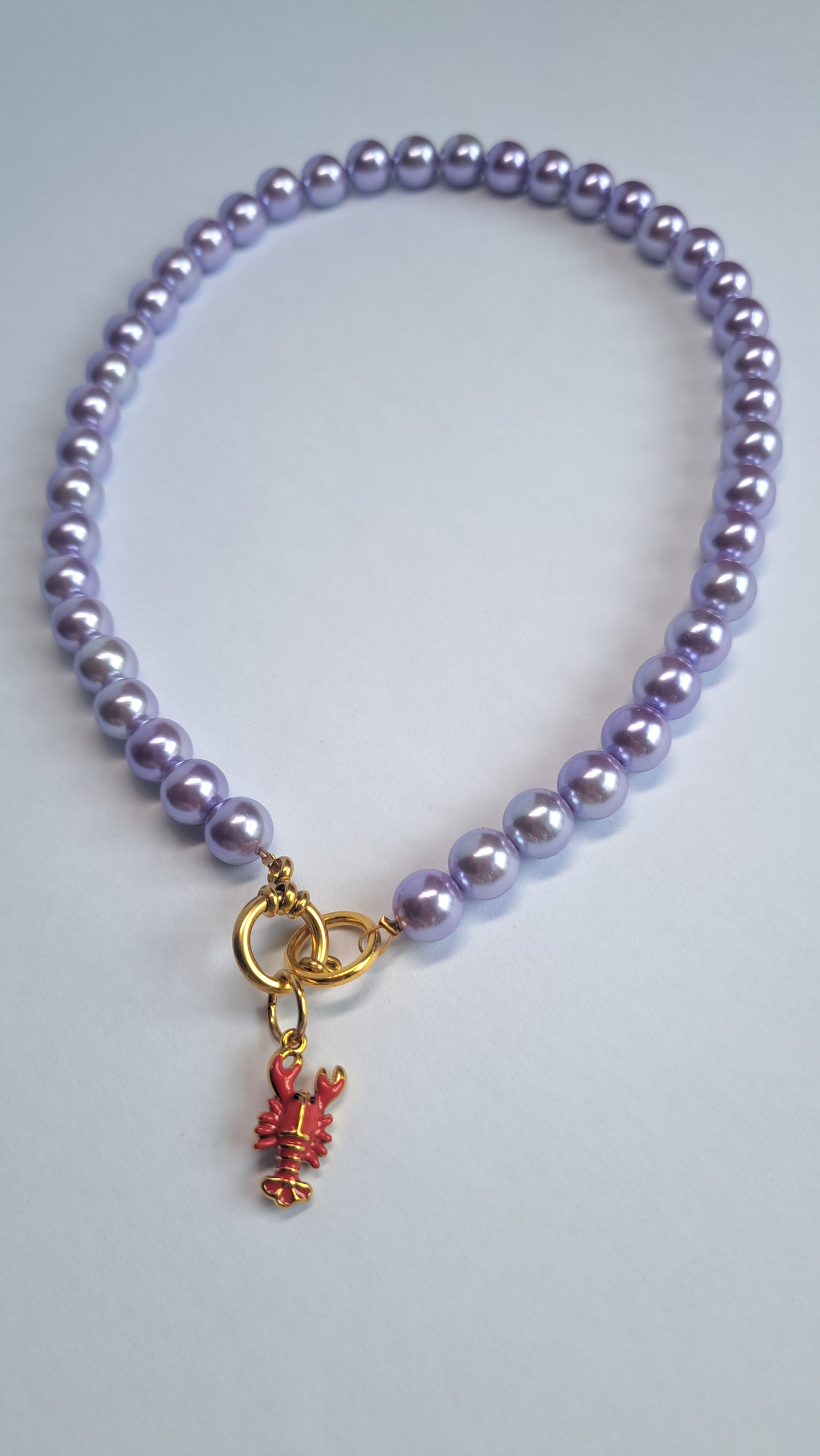 Paarse parelketting met kreeft bedel 2-WAY